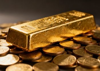 Barre d'or et pièces d'or, symbole d'investissement traditionnel.