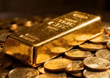 Barre d'or et pièces d'or.
