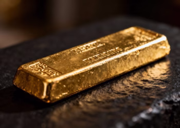 Barre d'or brillant sur fond sombre.
