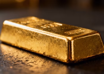 Barre d'or brillant sur fond sombre.