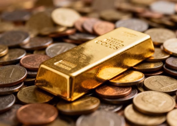 Barre d'or et pièces de monnaie pour le calcul du point mort.