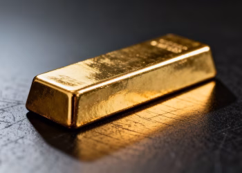 Barre d'or brillante sur fond sombre.
