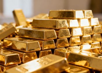 Lingots d'or empilés, symbole de richesse et d'investissement.