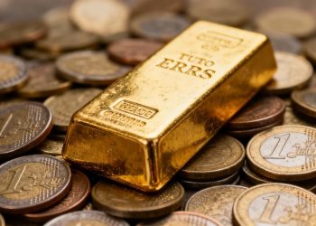 Barre d'or sur des pièces en euros.