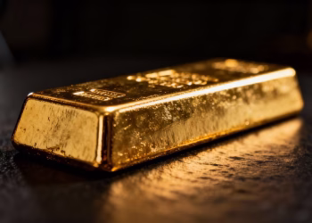 Lingot d'or sur fond sombre.