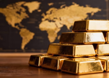 Lingots d'or et carte du monde dorée