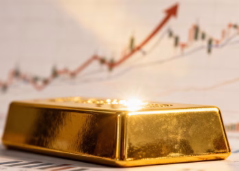 Barre d'or et graphique boursier pour le trading intraday.