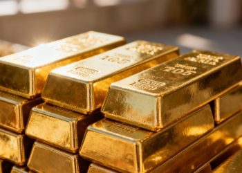Lingots d'or brillants empilés