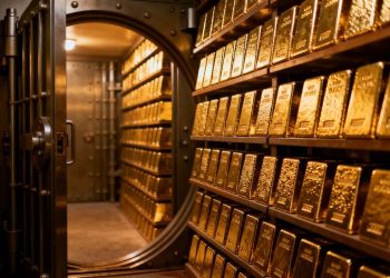 Barres d'or dans un coffre-fort sécurisé.