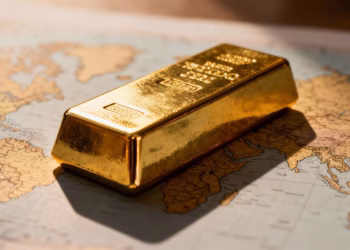 Lingot d'or sur une carte du monde.