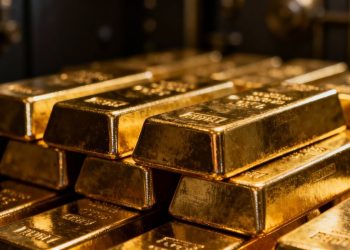 Lingots d'or brillants dans un coffre-fort.