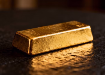 Barre d'or brillante sur fond sombre.