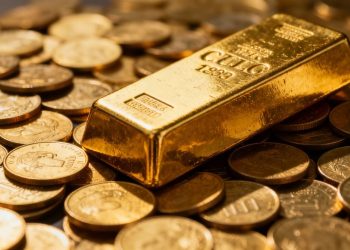 Lingots d'or et pièces d'or dans un portefeuille d'investissement.