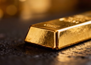 Barre d'or sur fond sombre, symbole de valeur.