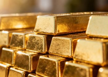 Lingots d'or brillants empilés en Suisse.