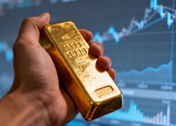 Main d'or tenant une barre d'or, marché financier