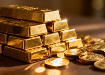 Lingots et pièces d'or brillants.