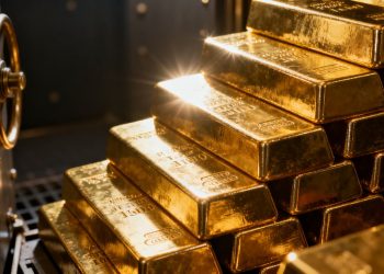 Lingots d'or empilés dans un coffre-fort.