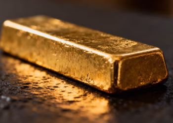 Barre d'or brillant sur fond sombre.
