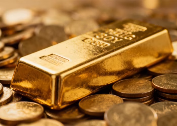 Barre d'or sur des pièces d'or