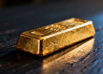 Barre d'or brillante sur fond sombre.