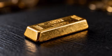 Shiny gold bar on dark background.