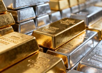 Shiny gold and platinum ingots.