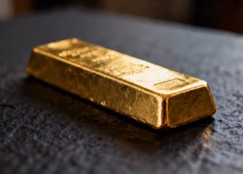 Shiny gold bar on dark background.