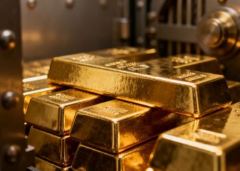 Lingots d'or brillants dans un coffre-fort.