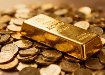 Barre d'or sur des pièces d'or