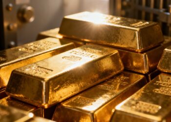Lingots d'or brillants dans un coffre-fort.