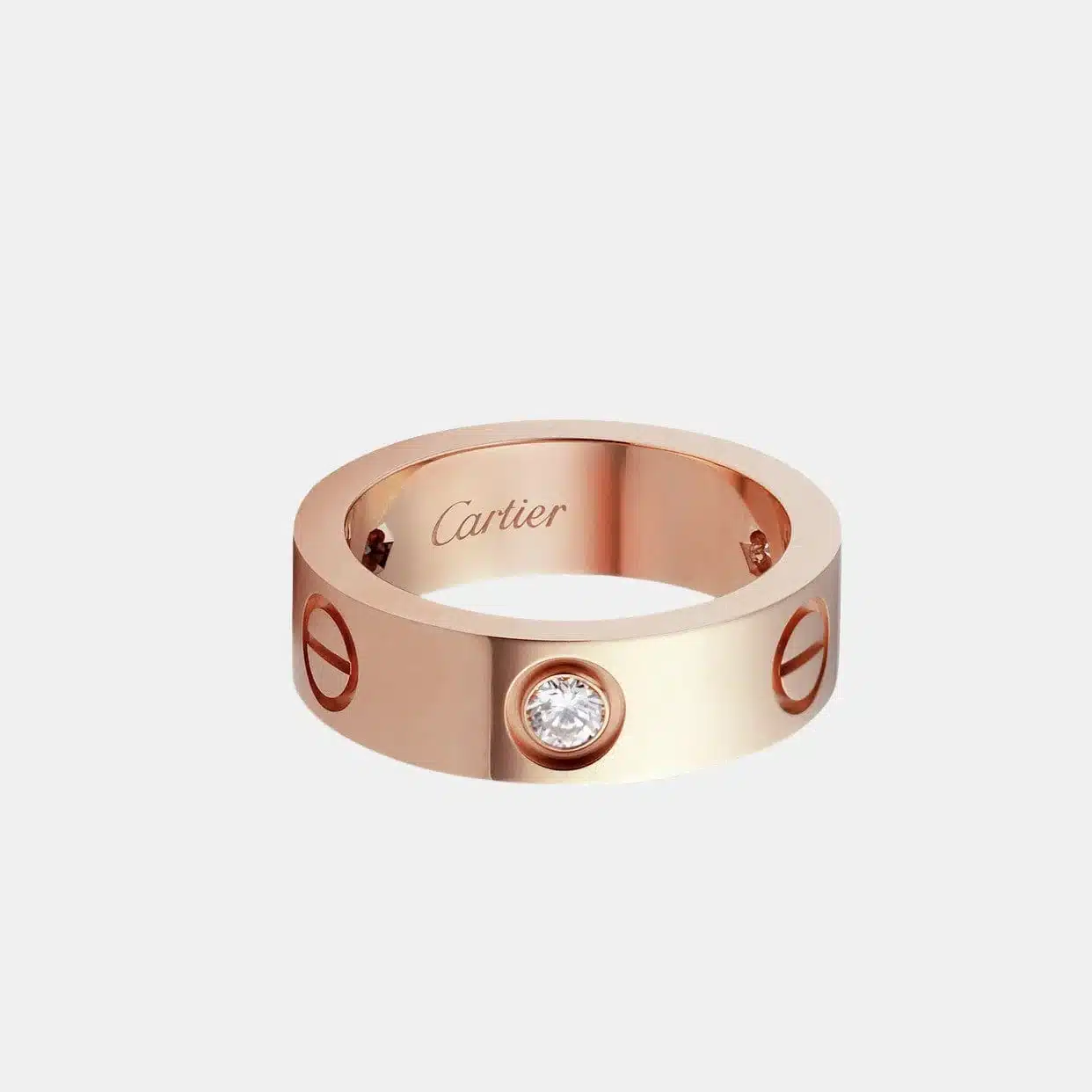Bague Love Cartier en or rose, 3 diamants largeur 5,5 mm — photographie du modèle, cote d’occasion GOLDMARKET