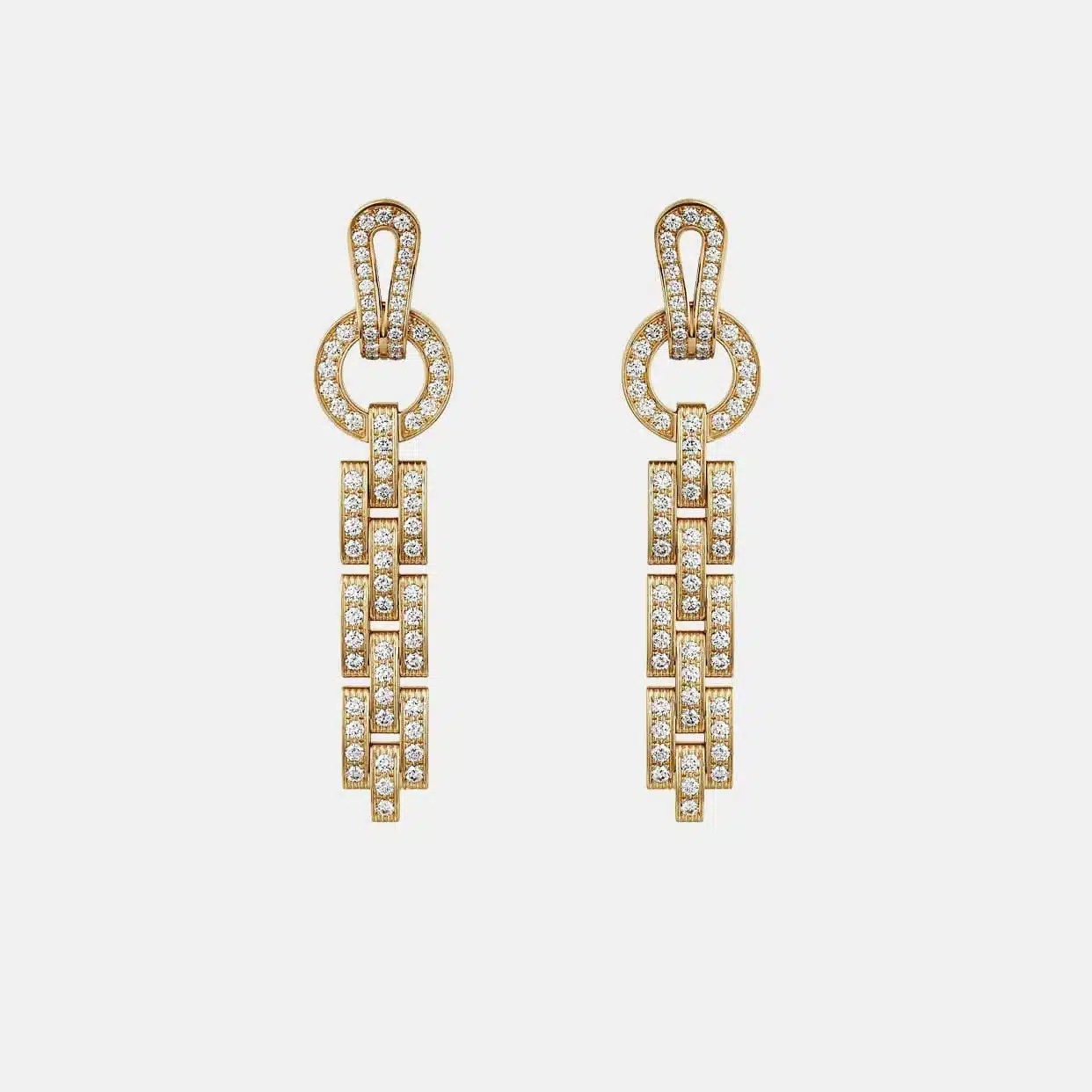 Boucles d’oreilles Agrafe Cartier en or jaune, diamant