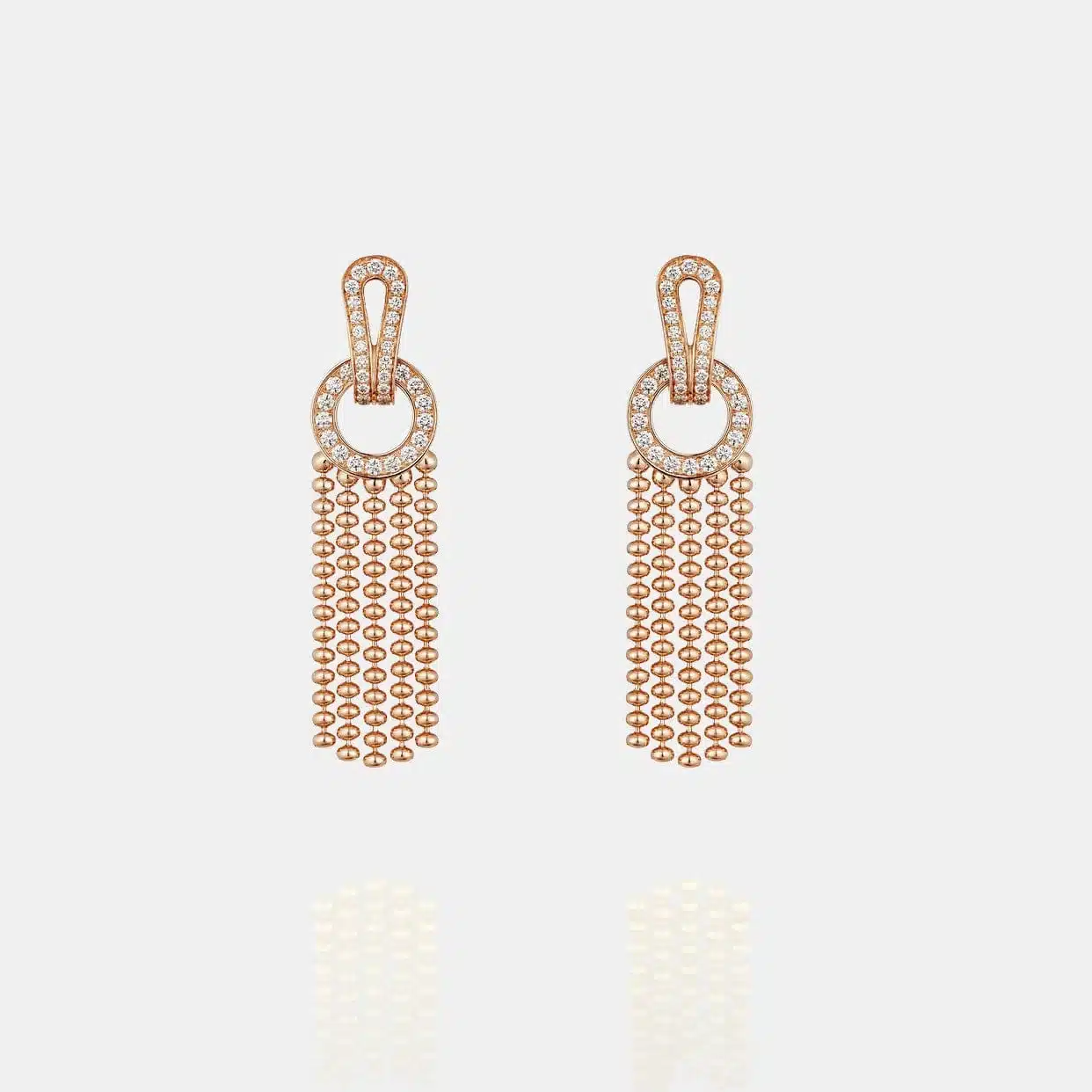 Boucles d’oreilles Agrafe Cartier en or rose, diamant