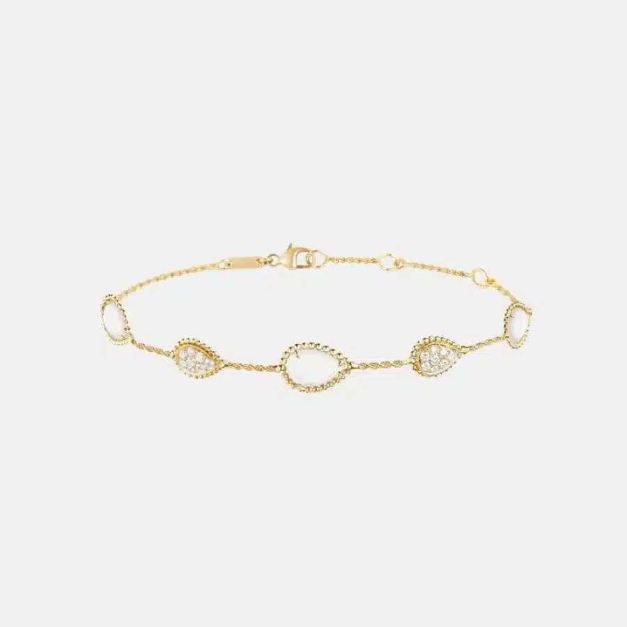 Bracelet Serpent Bohème Boucheron en or jaune, perle 4.2ct, cinq motifs. — photographie du modèle, cote d’occasion GOLDMARKET