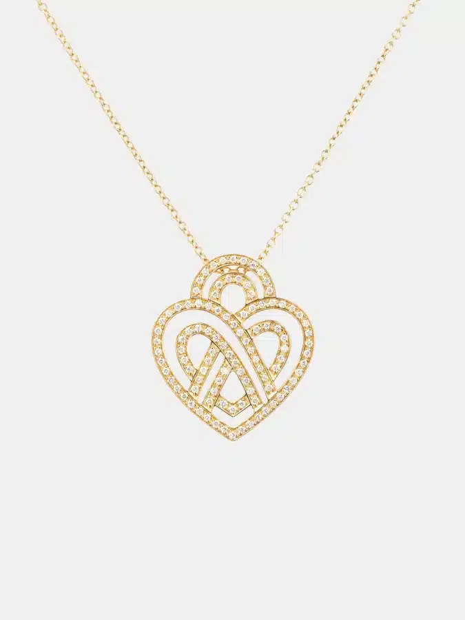 Collier Coeur Entrelacé Poiray en or jaune, diamant 0.4ct — photographie du modèle, cote d’occasion GOLDMARKET